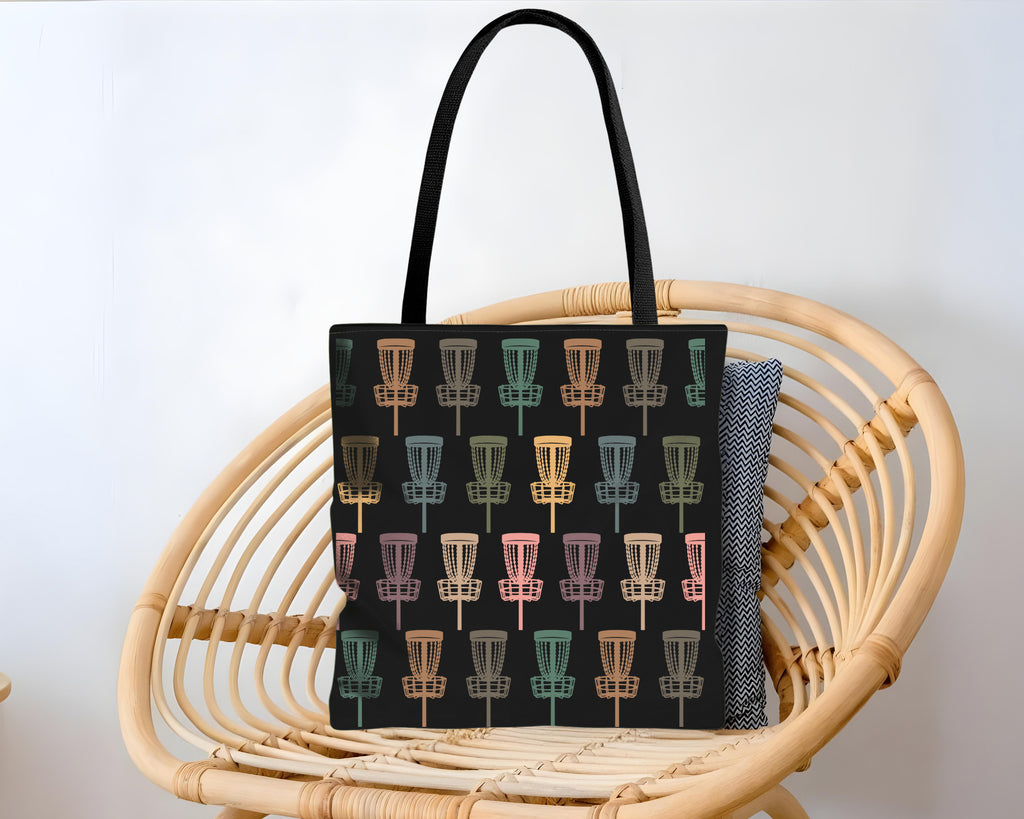 Black tote bag with colorful disc golf disc pattern background