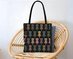 Black tote bag with colorful disc golf disc pattern background