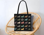 Black tote bag with dog pattern and initial name text