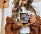 Person holding a black mug with colorful designs, wearing a brown sweater.