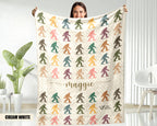 Person holding a blanket with colorful Bigfoot patterns and the name text on a  background.