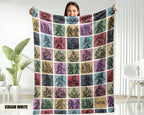 Person holding a colorful blanket with bigfoot patterned design.