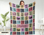 Person holding a colorful patterned blanket with text printed on it.