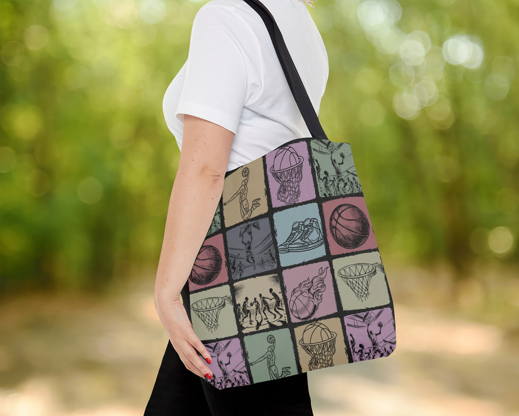 Person holding a tote bag with sports-themed Basketball design outdoors