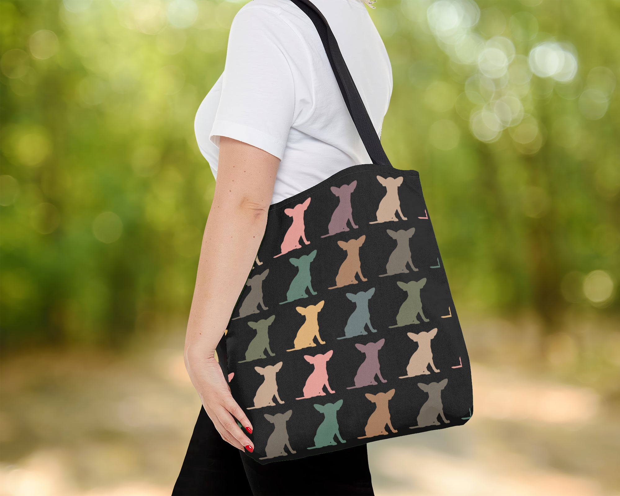 Tote bag with dog pattern held by a person outdoor